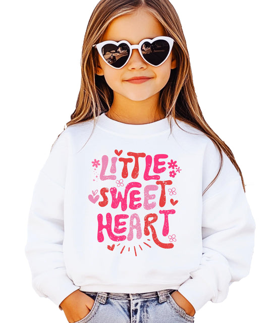Close-up of pink hearts and flowers graphic print on girls' Valentine sweatshirt