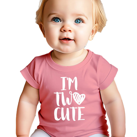 Close-up of I'm Two Cute birthday shirt graphic design on mauve toddler tee