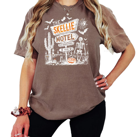Skellie Motel retro Halloween graphic tee in seafoam, featuring skeleton and spooky motel design, unisex adult fit