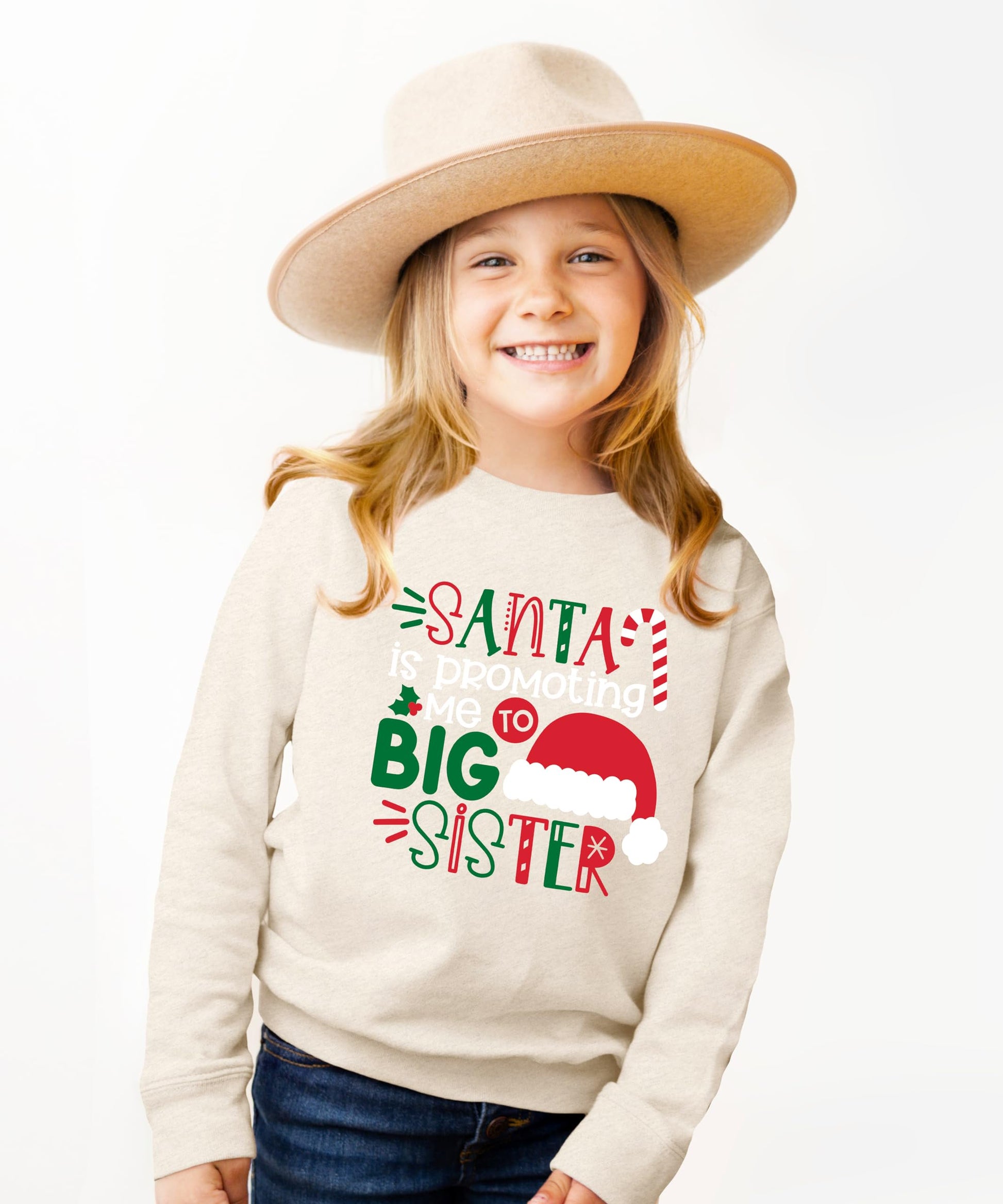 Full-length view of toddler wearing a holiday Big Sister announcement sweatshirt with Santa design