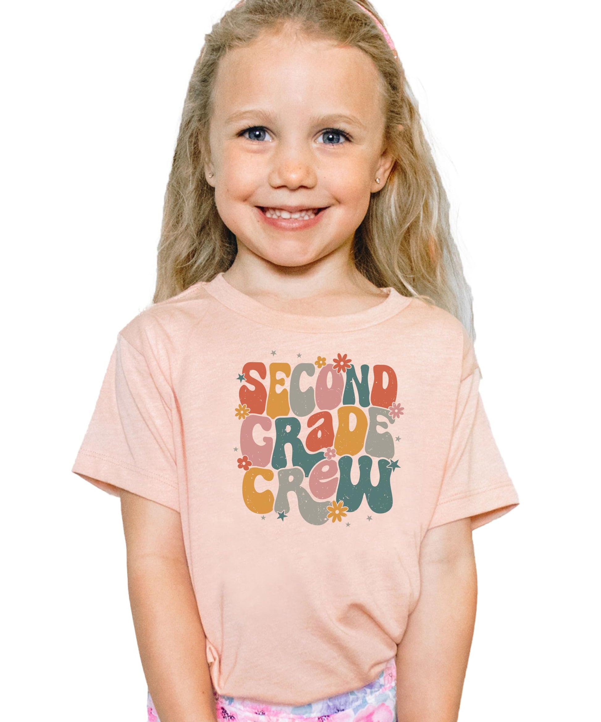 Women's version of retro second grade vintage flower school tee laid flat