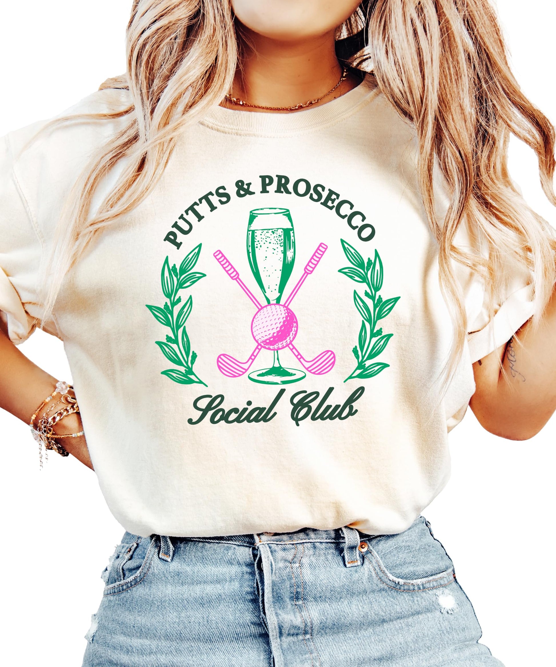Close-up of Putts and Pros Social Club design on women's ivory golf shirt