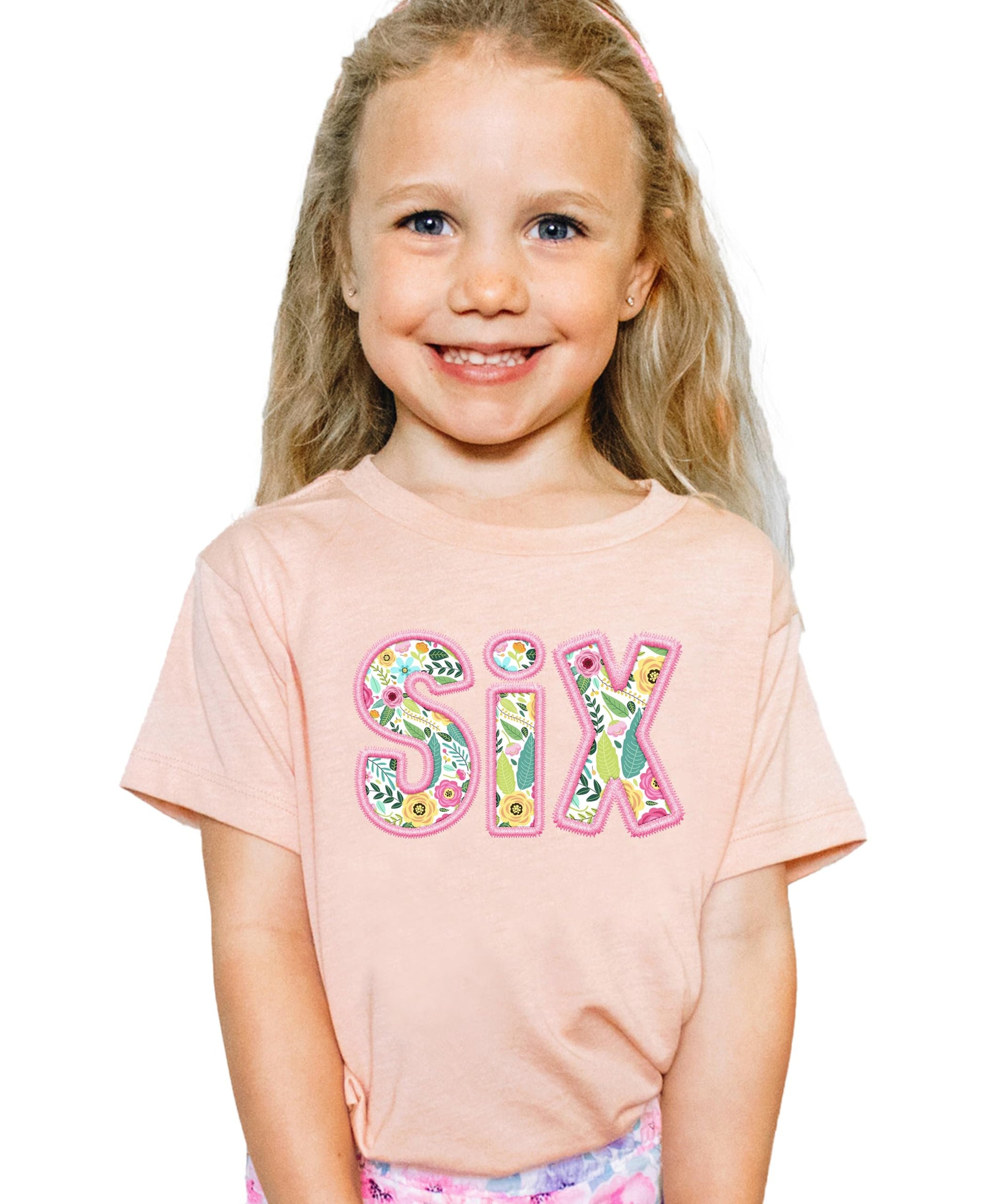 Peach kids tee with floral SIX design and pink embroidered-look print for girls 6th birthday