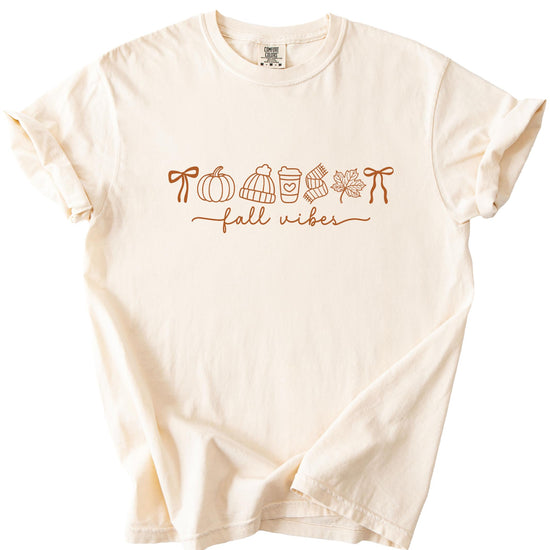 Fall themed graphic t-shirt product shot displaying pumpkin coffee leaf print