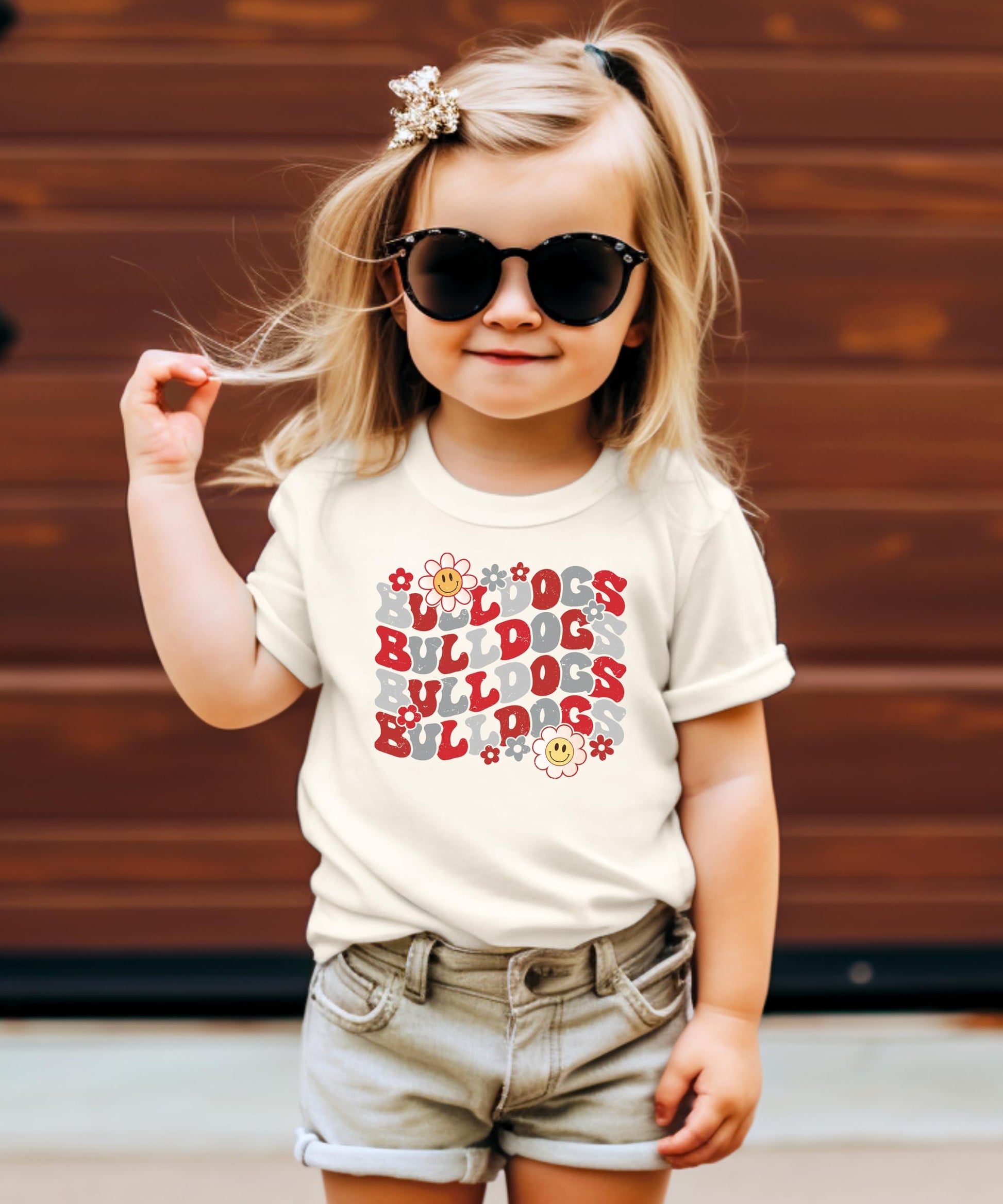 Red Bulldogs school pride shirt flat lay showing design and sizing options