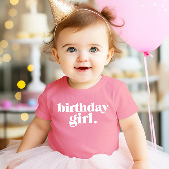 Close-up of Birthday Girl Period crown graphic print on purple kids tee