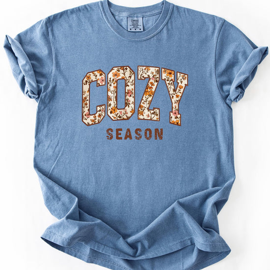 Detail shot of high-quality print on Cozy Season orange floral women's tee