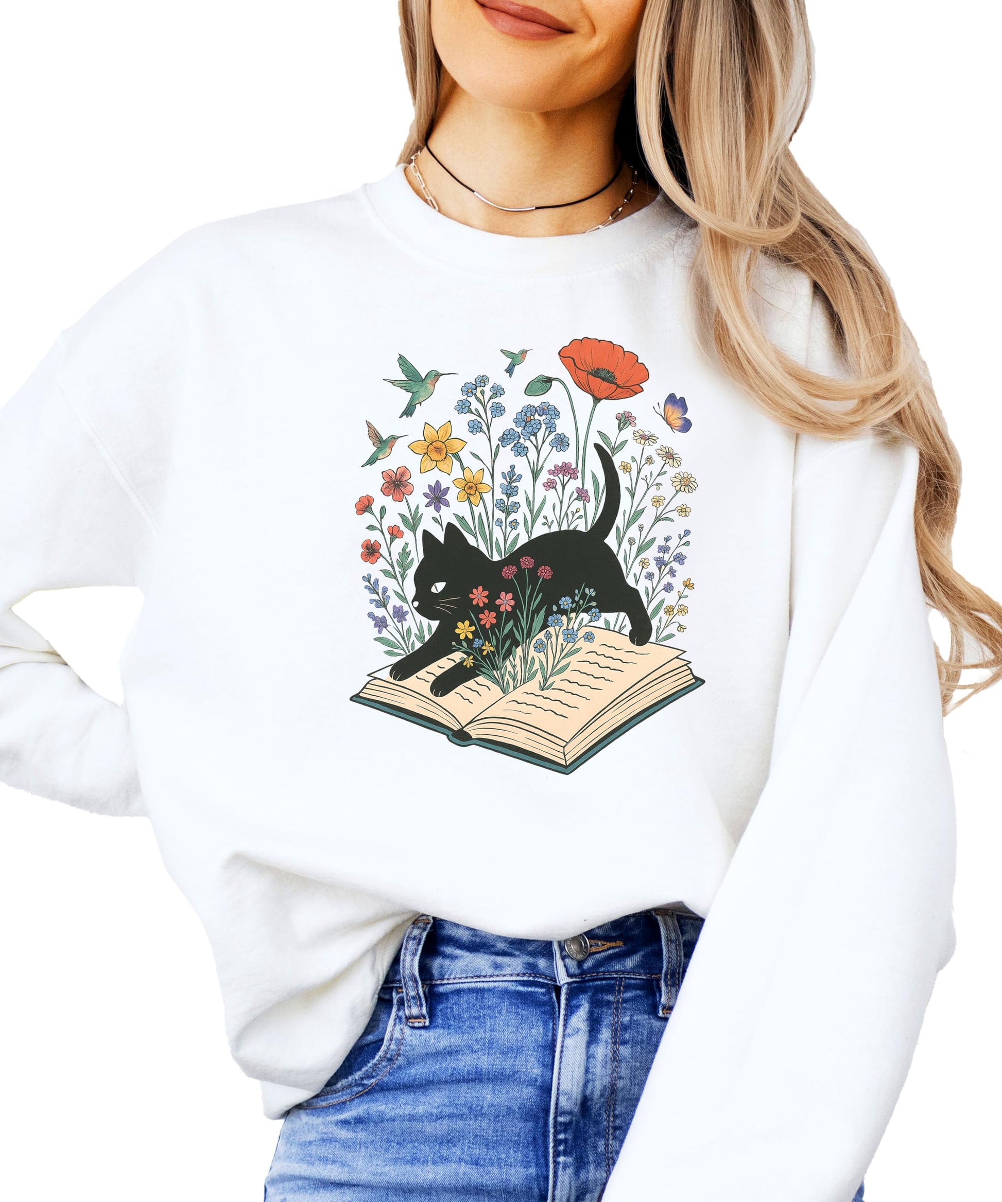 Youth size white sweatshirt featuring black cat and floral open book design for kids who love reading