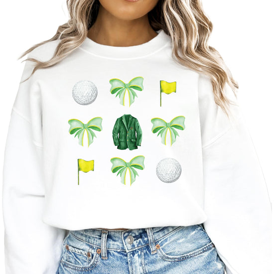 White pullover sweatshirt with green bows and golf balls graphic design for women and teens