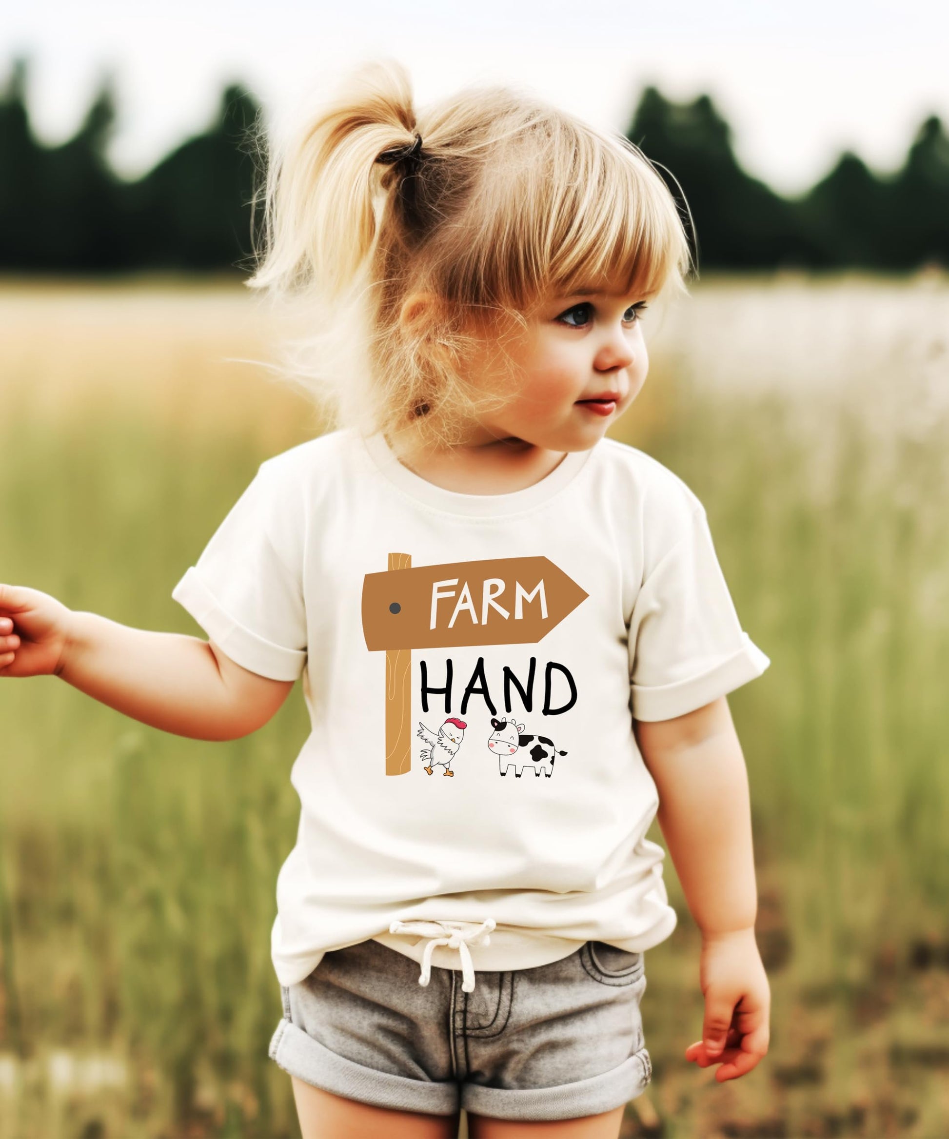Front view of unisex kids farm graphic tee with cow and chicken design on natural fabric