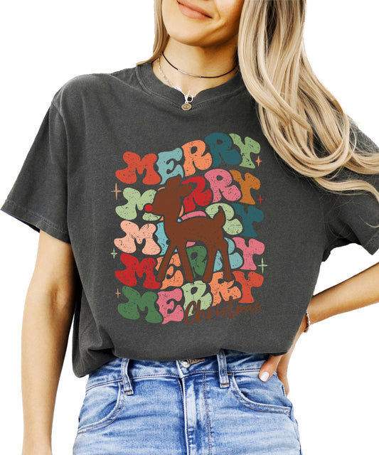 Women's retro Merry Christmas graphic tee with groovy red-nosed reindeer design in festive holiday colors