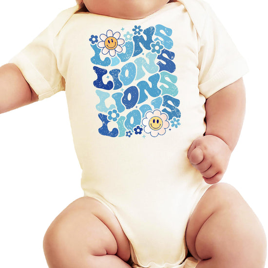Blue Lions team spirit graphic tee on woman with mascot design