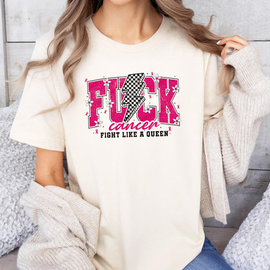 Woman wearing pink Fight Like a Queen cancer awareness t-shirt showing front design and fit