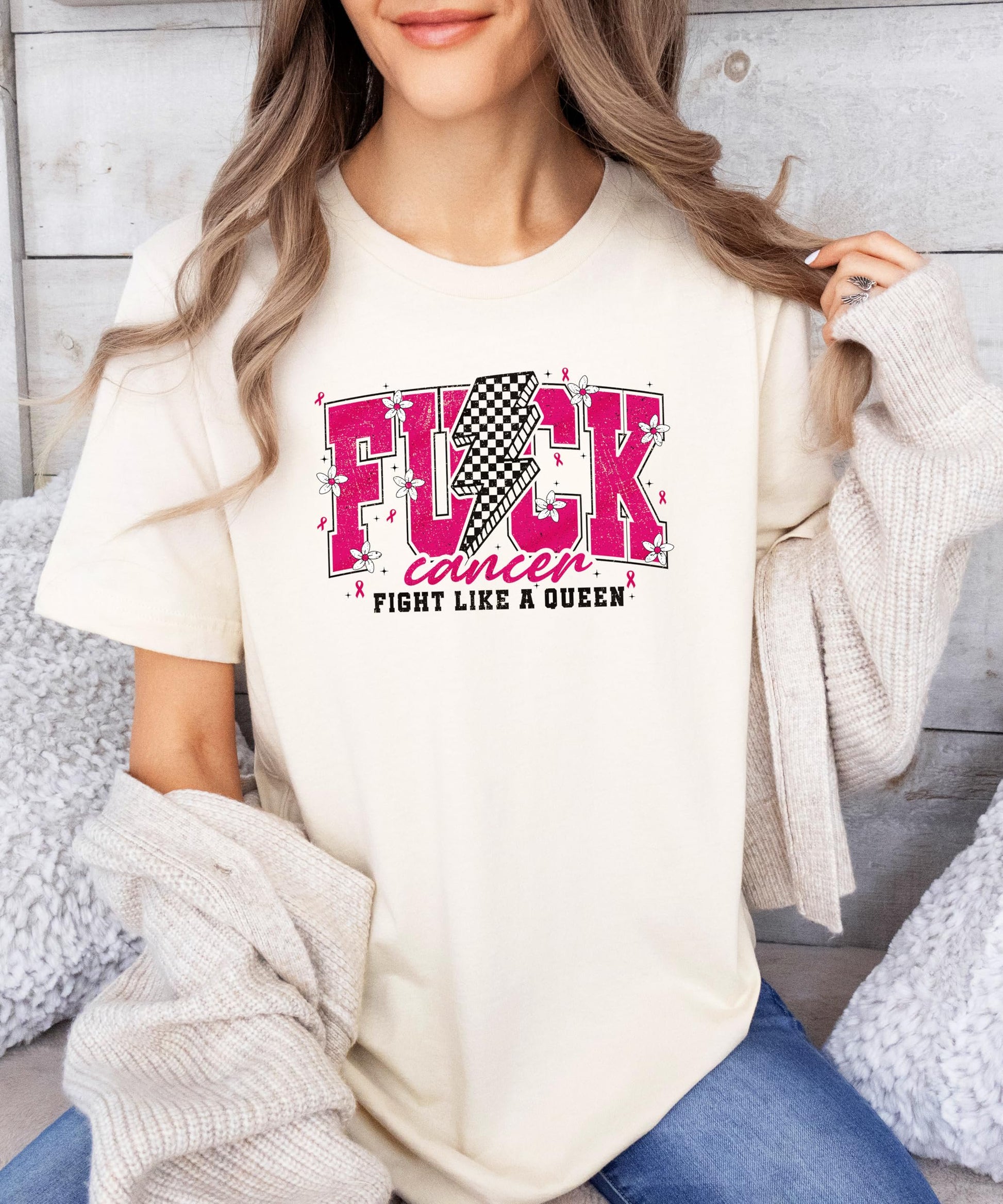 Woman wearing pink Fight Like a Queen cancer awareness t-shirt showing front design and fit