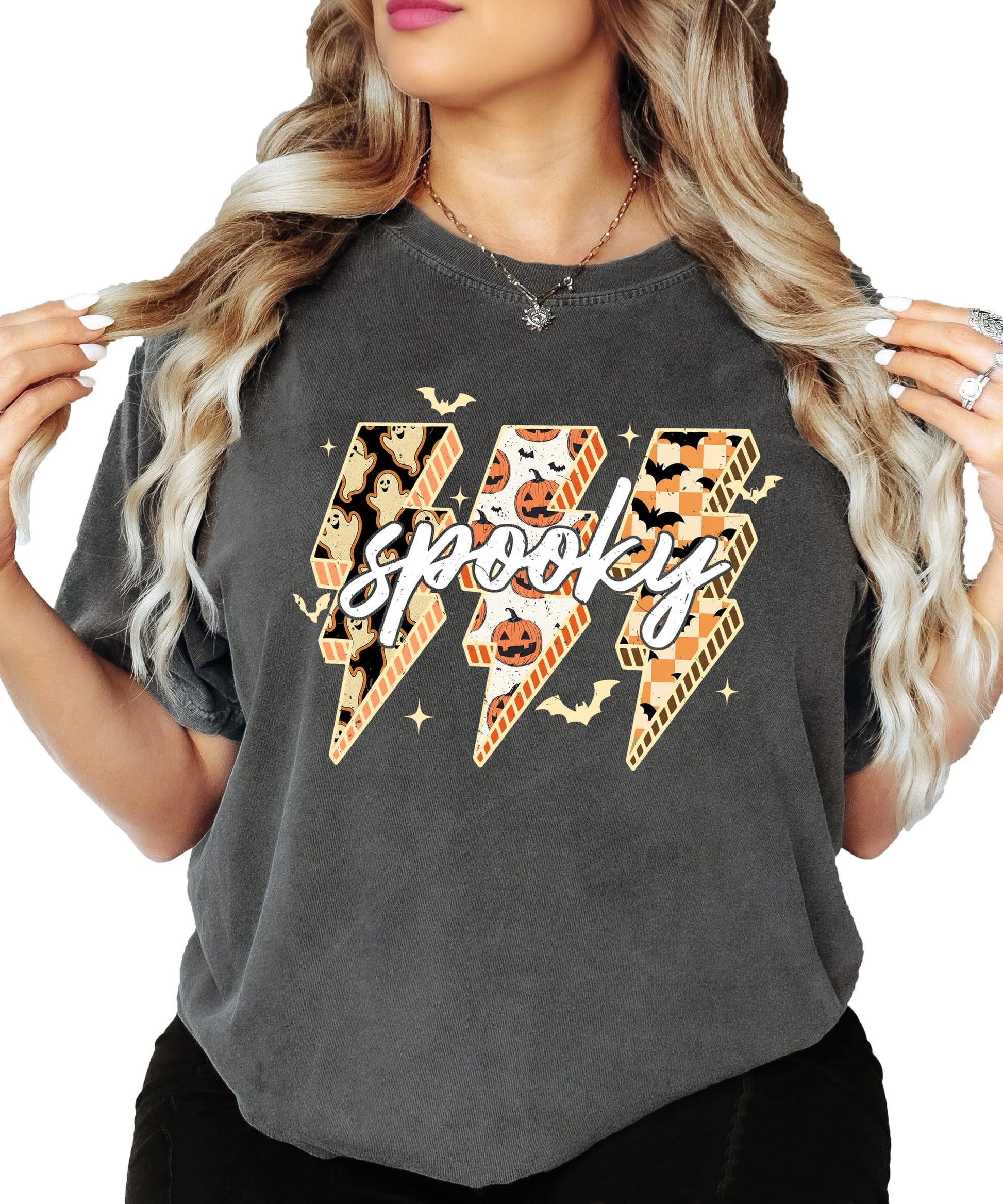 Side or lifestyle view of women's oversized Halloween graphic tee in dark brown with spooky lightning bolt print