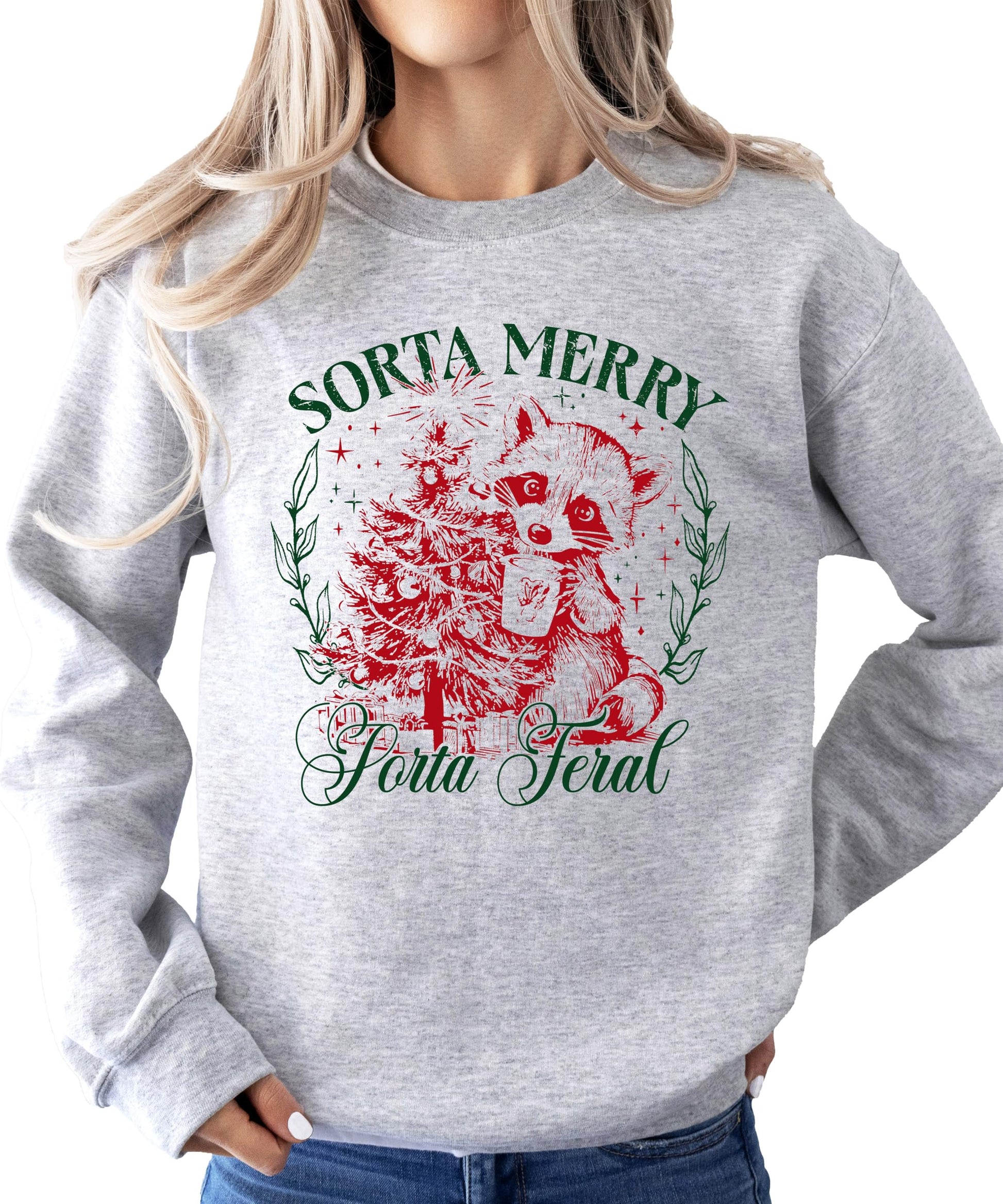 Flat lay of white funny holiday crewneck sweatshirt with Sorta Merry Sorta Feral raccoon design