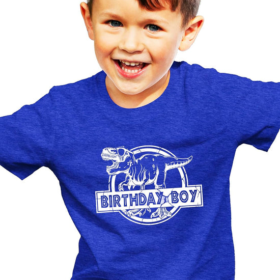Kids wearing Birthday Boy dinosaur shirts in black and royal blue at birthday party