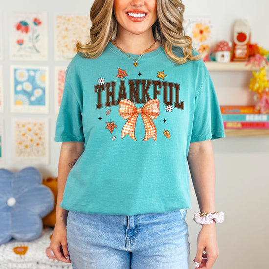Detail shot of high-quality print on Thankful fall tee with gingham bow accent