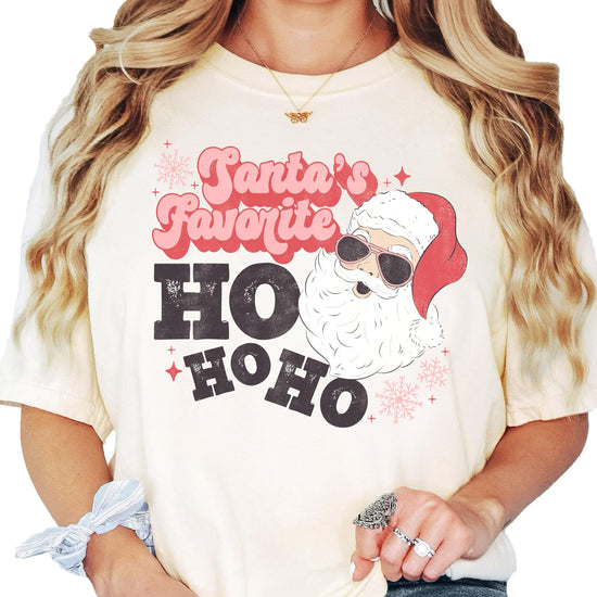 Model wearing Santa's Favorite Ho Ho Ho funny holiday tee in seafoam green