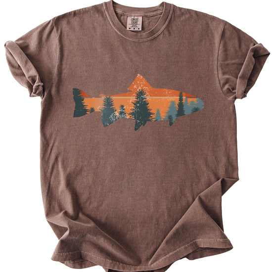 Lifestyle shot of person wearing seafoam trout fishing sunset graphic t-shirt
