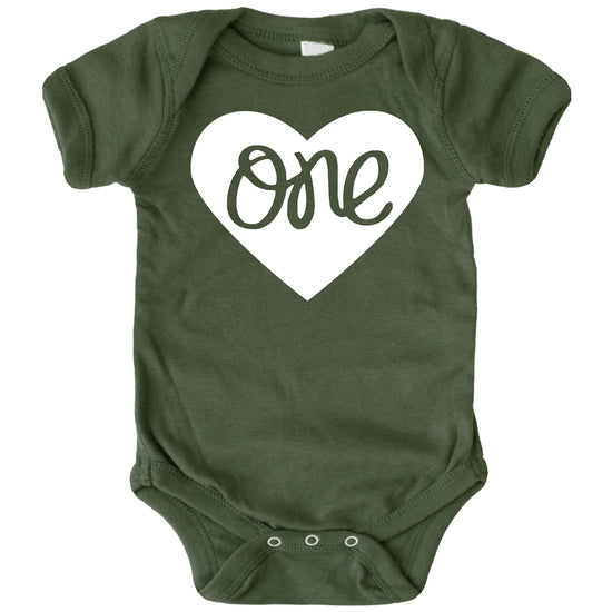 Baby girls first birthday bodysuit in military green with bold heart one graphic, flat lay view