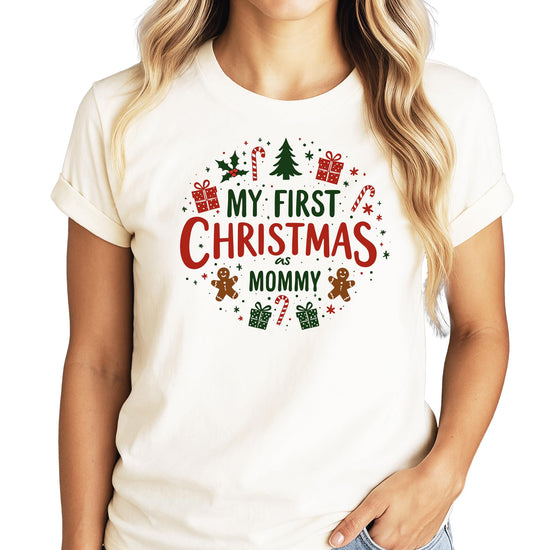 Mom and baby wearing matching My First Christmas graphic tees for holiday photos
