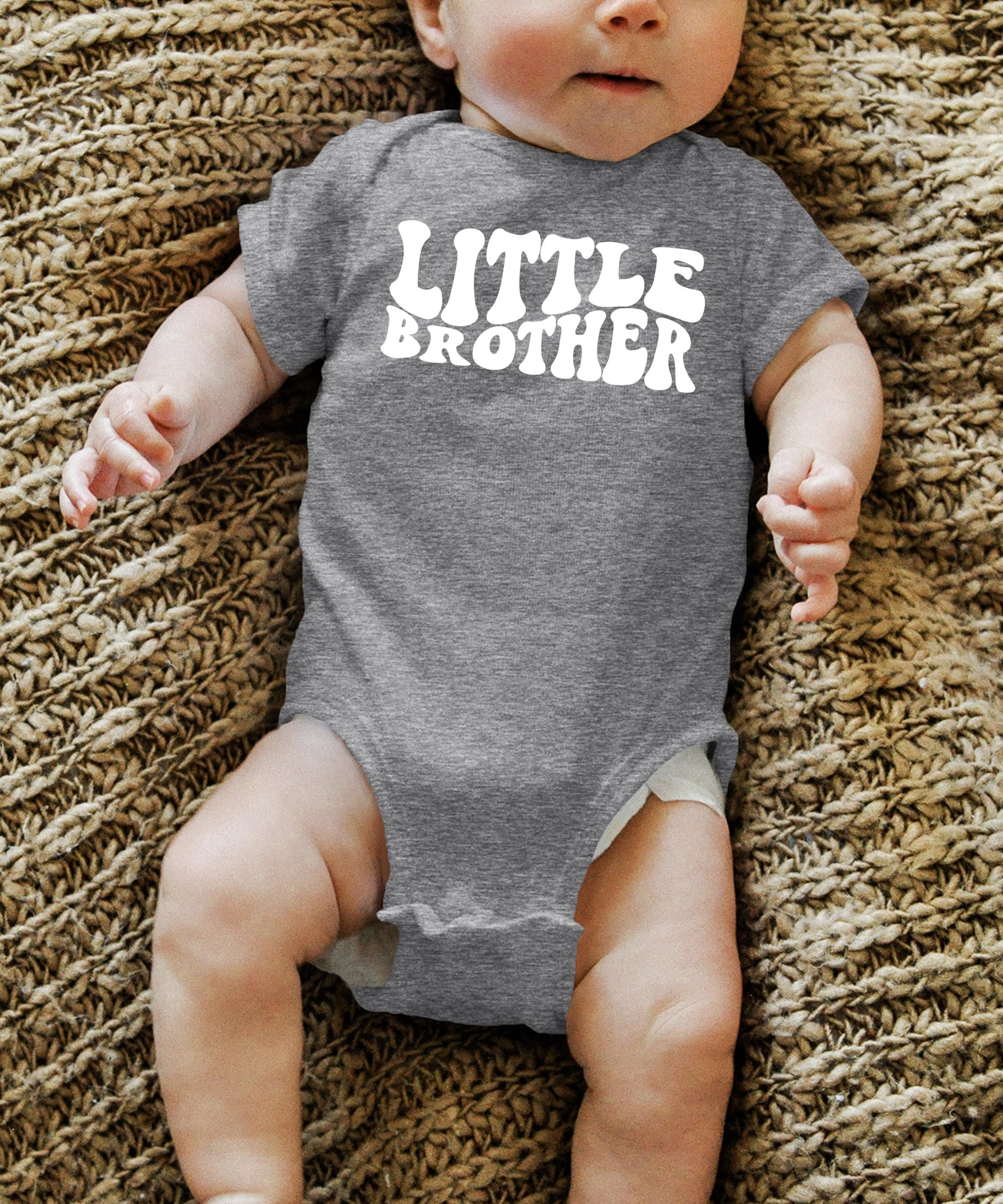 Little Brother baby onesie displayed to show sizing and fit for newborns