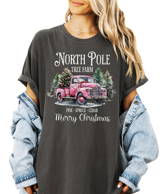 Close-up view of red vintage truck graphic with Christmas tree and North Pole Tree Farm text