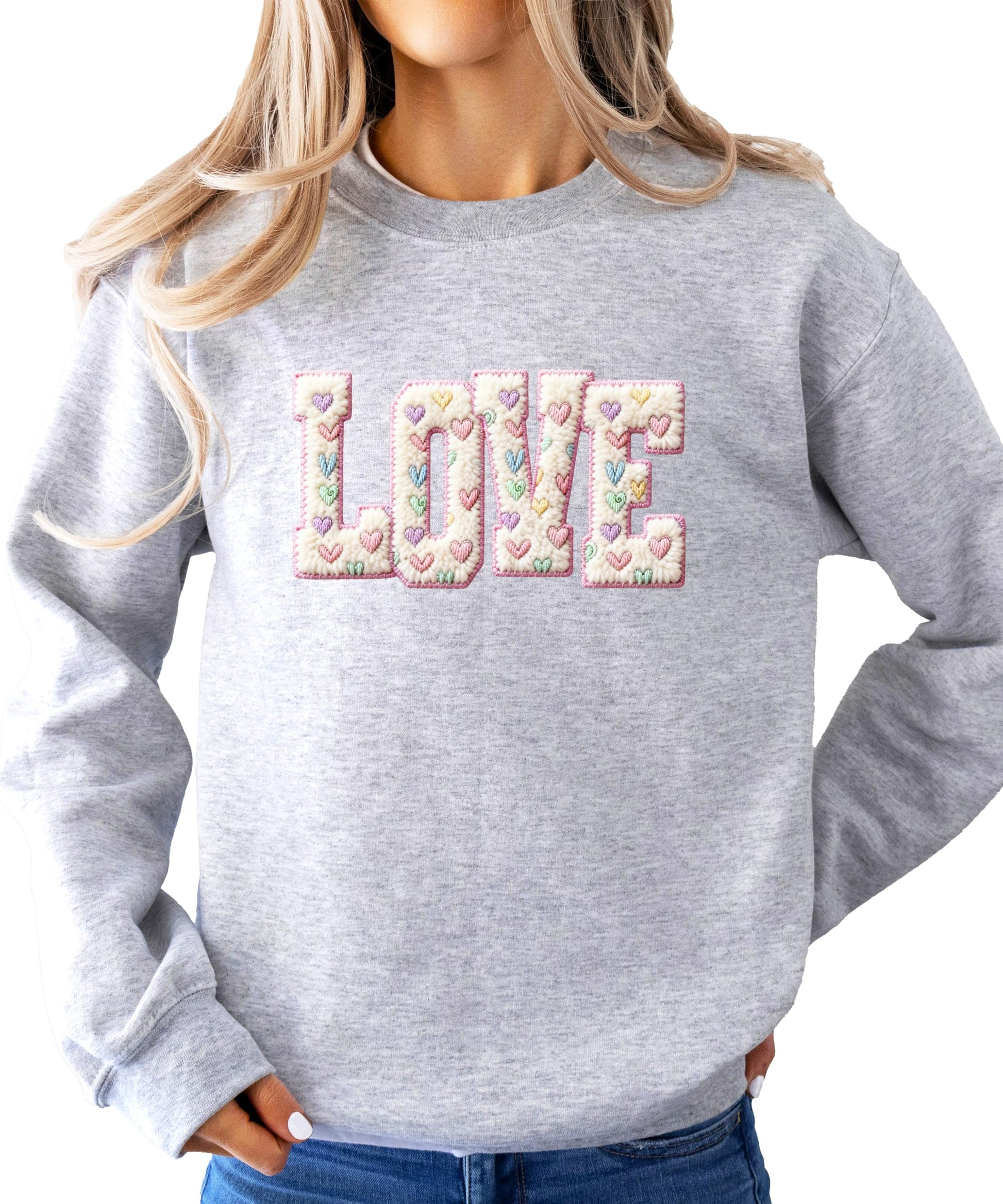 Side view of pink LOVE pullover sweatshirt showing relaxed casual fit