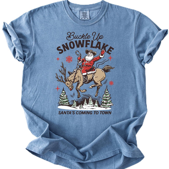 Close-up of cowboy Santa riding a reindeer graphic print on ivory Christmas shirt