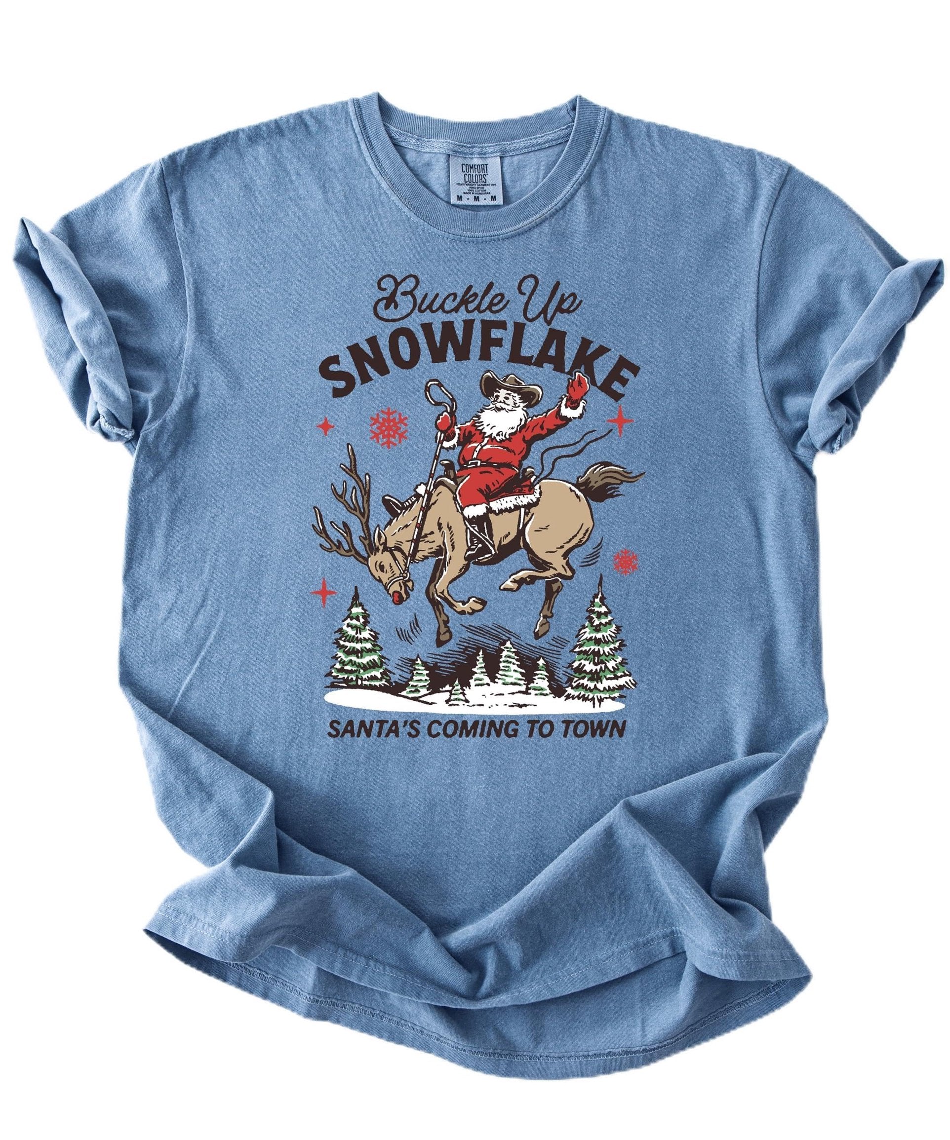 Close-up of cowboy Santa riding a reindeer graphic print on ivory Christmas shirt