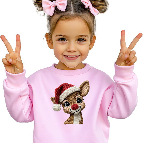 Side or lifestyle view of white holiday reindeer sweatshirt with festive yarn patch print