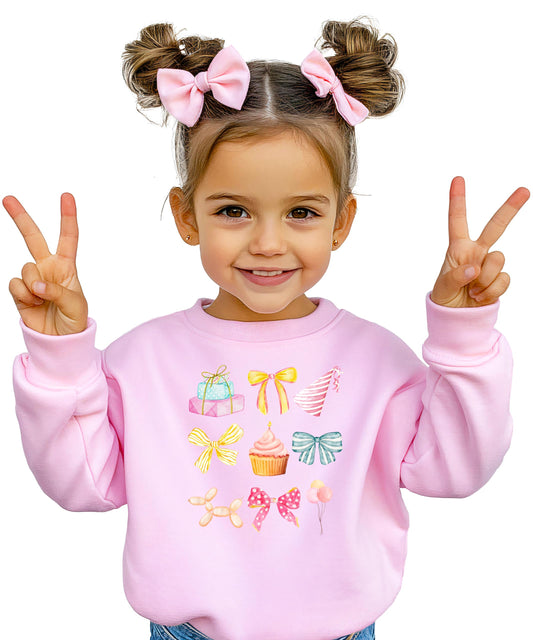 Pastel coquette birthday sweatshirt for kids with bow, cupcake, and balloon graphic in pink tones