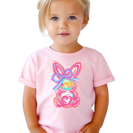 Side or lifestyle view of girls colorful Easter bunny bow shirt for spring