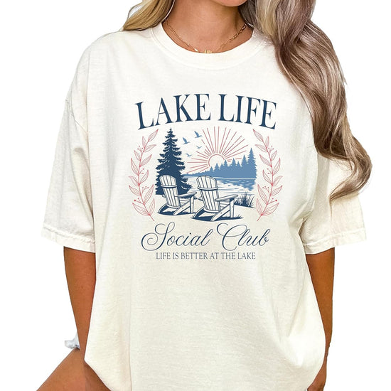 Woman wearing Lake Life Social Club graphic tee styled with jeans in casual summer outfit