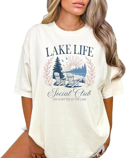 Woman wearing Lake Life Social Club graphic tee styled with jeans in casual summer outfit