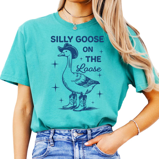 Woman wearing ivory Silly Goose graphic tee showing relaxed oversized fit