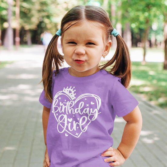 Birthday girl in purple princess crown shirt — front view