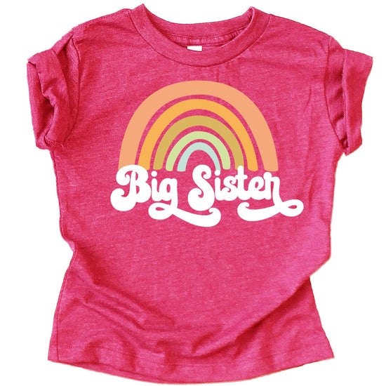 Detail shot of retro rainbow Big Sister sibling announcement shirt showing print quality and color