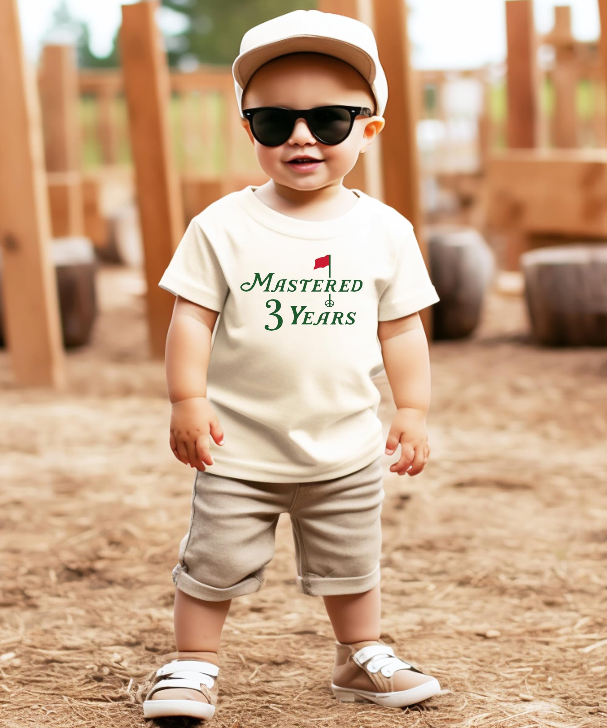 Toddler wearing a natural golf-themed third birthday shirt with Mastered 3 Years design