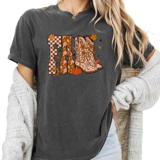 Front view of women's fall cowgirl shirt in seafoam featuring cowboy boots and pumpkin season graphic print