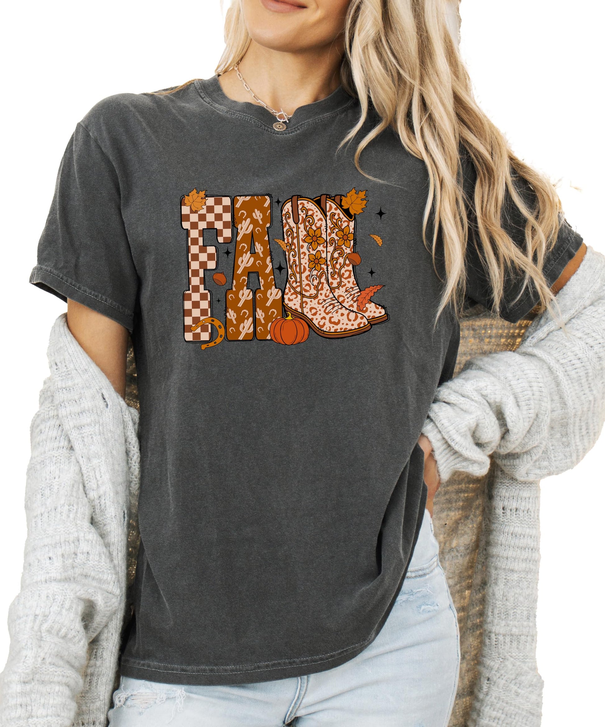 Front view of women's fall cowgirl shirt in seafoam featuring cowboy boots and pumpkin season graphic print