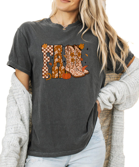 Front view of women's fall cowgirl shirt in seafoam featuring cowboy boots and pumpkin season graphic print