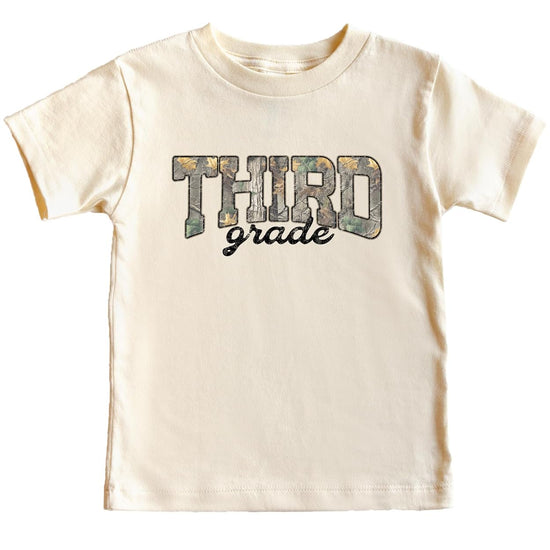 Boy wearing third grade camouflage shirt in military green for back to school