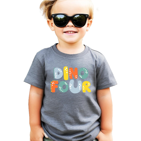 Child wearing Dino Four 4th birthday graphic tee in royal blue