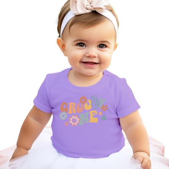 Flat lay of natural Groovy One 1st birthday shirt for toddler girls