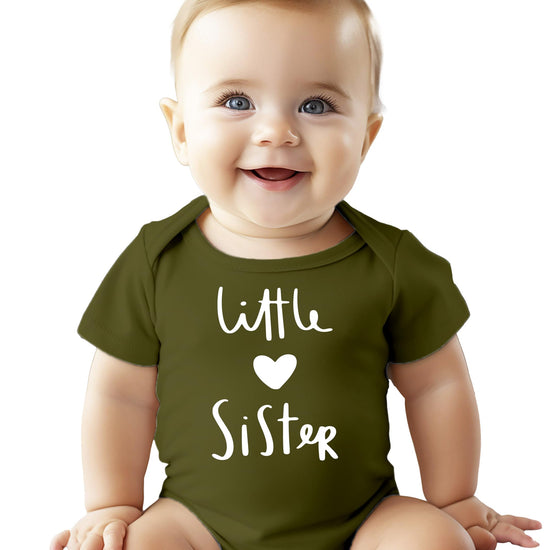 Close-up of Little Sister heart print on soft white baby bodysuit in mauve colorway