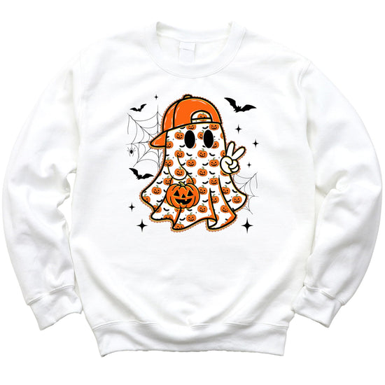 Close-up of ghost graphic on boys white fall sweatshirt showing pumpkin baseball cap and jack-o-lantern detail
