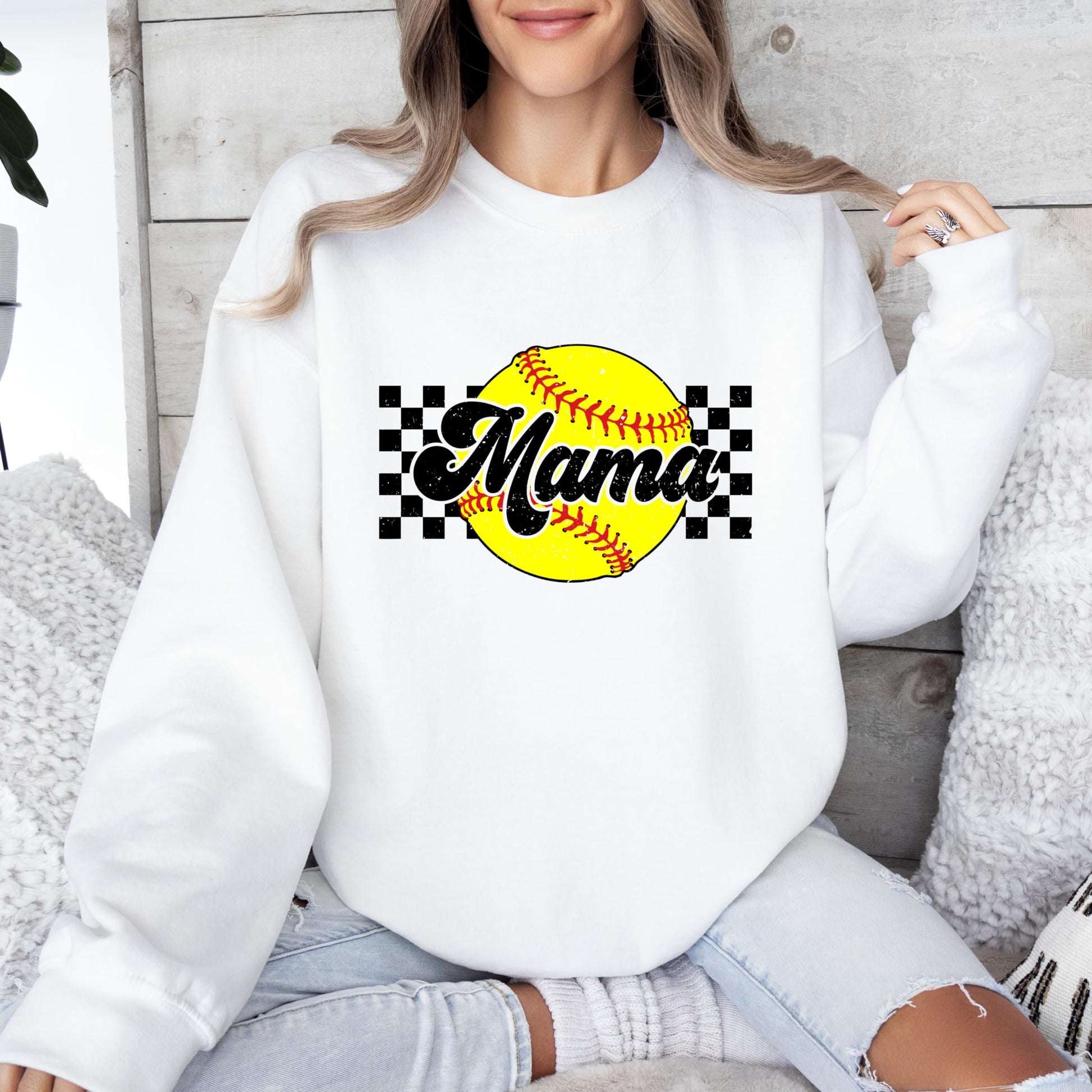 Close-up of Softball Mama sweatshirt graphic detail with yellow checkered design