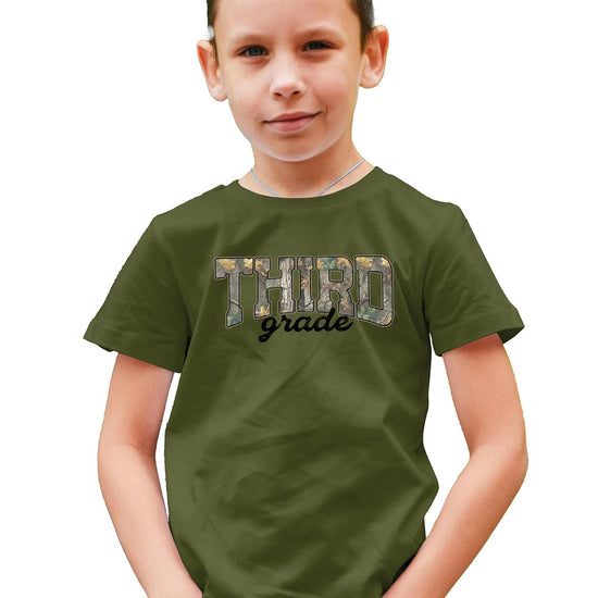 Close-up of woodland camouflage 'Third Grade' screen-printed graphic on kids cotton tee